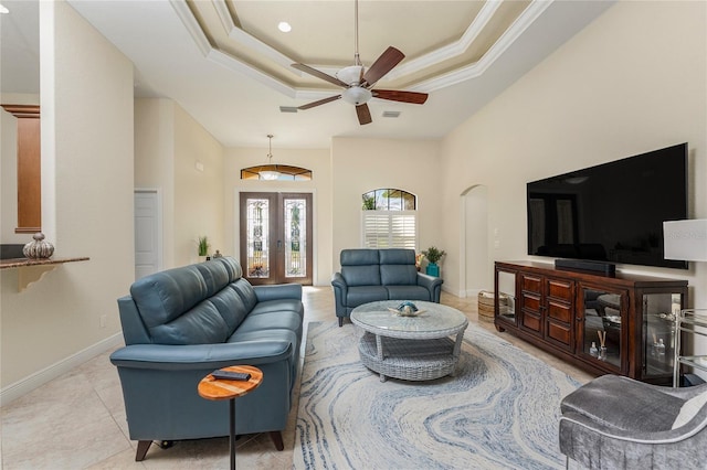 4015 La Costa Island Ct, Punta Gorda, FL 33950 - living area with a tray ceiling, a ceiling fan, french doors, baseboards, and tile patterned floors