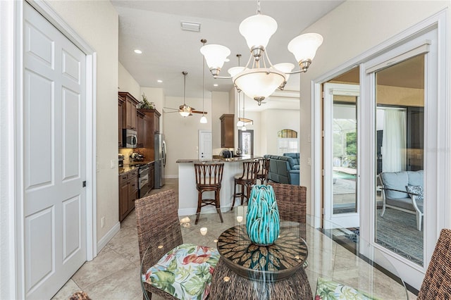 4015 La Costa Island Ct, Punta Gorda, FL 33950 - dining room featuring a chandelier, recessed lighting, baseboards, and ceiling fan
