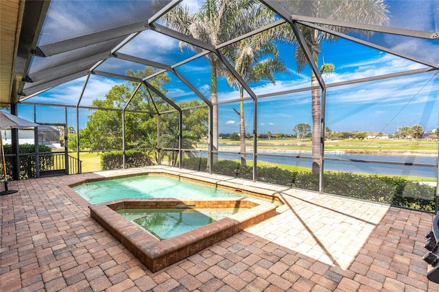 4015 La Costa Island Ct, Punta Gorda, FL 33950 - view of pool with a water view, a patio, glass enclosure, and a pool with connected hot tub