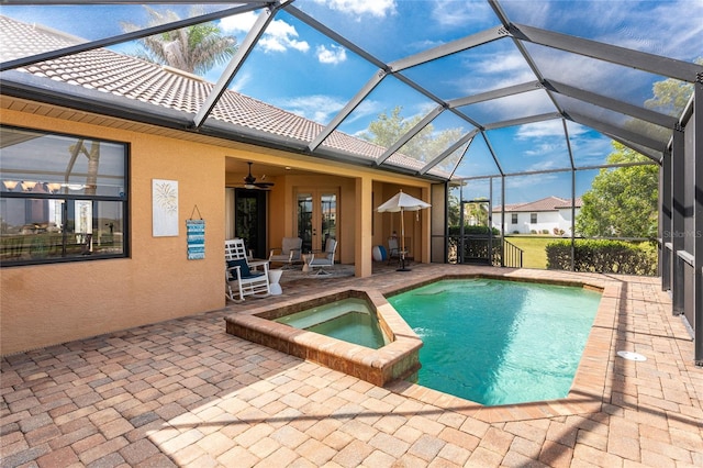 4015 La Costa Island Ct, Punta Gorda, FL 33950 - view of swimming pool with a patio area, ceiling fan, a pool with connected hot tub, a lanai, and french doors
