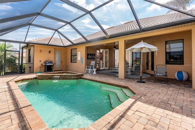 4015 La Costa Island Ct, Punta Gorda, FL 33950 - view of swimming pool featuring a patio area, a grill, a lanai, and a pool with connected hot tub