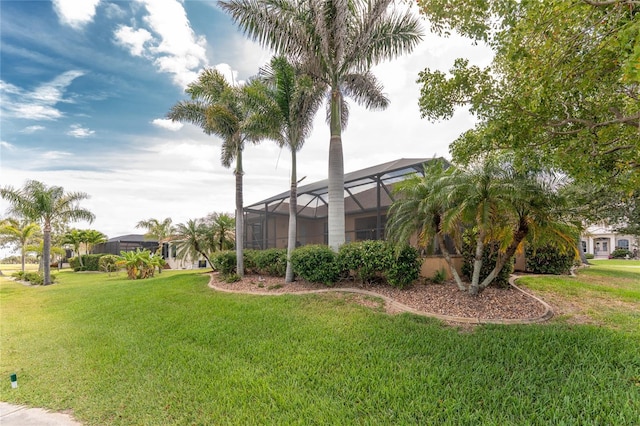4015 La Costa Island Ct, Punta Gorda, FL 33950 - view of green lawn featuring a lanai