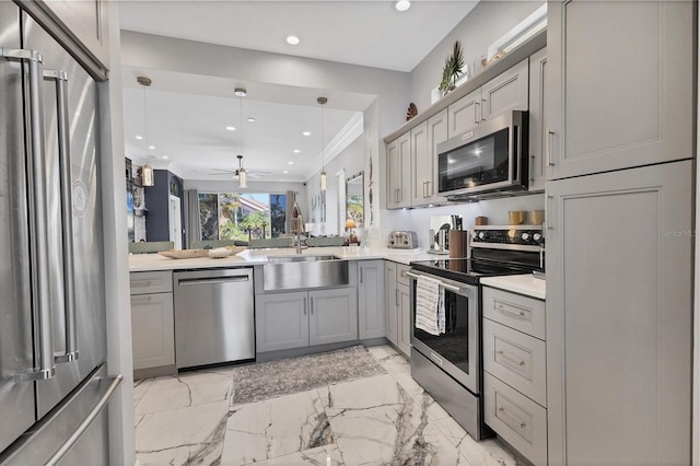 303 11th Ave E, Palmetto, FL 34221 - kitchen with appliances with stainless steel finishes, gray cabinetry, a sink, recessed lighting, and light countertops