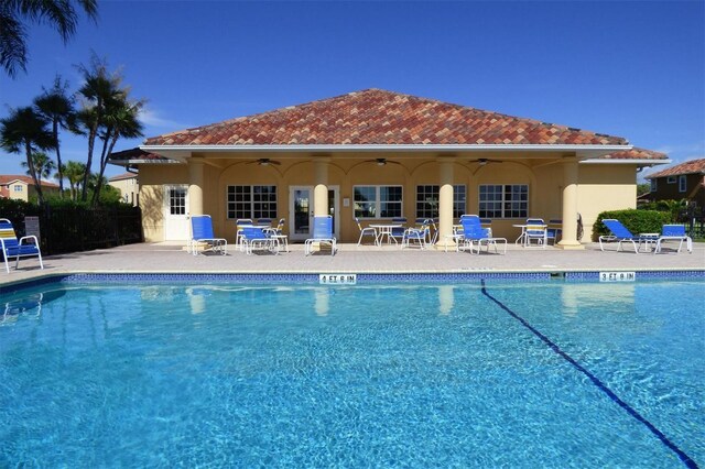 303 11th Ave E, Palmetto, FL 34221 - community pool featuring ceiling fan and a patio area