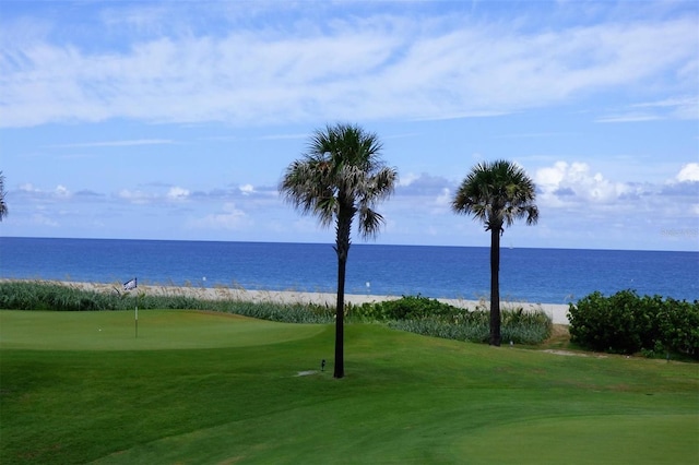 303 11th Ave E, Palmetto, FL 34221 - view of property's community featuring an area to practice putting, a water view, view of golf course, and a lawn
