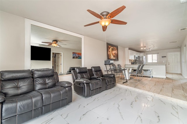 4516 Santa Barbara Blvd Unit 1, Cape Coral, FL 33914 - living area with marble finish floor, a ceiling fan, and visible vents