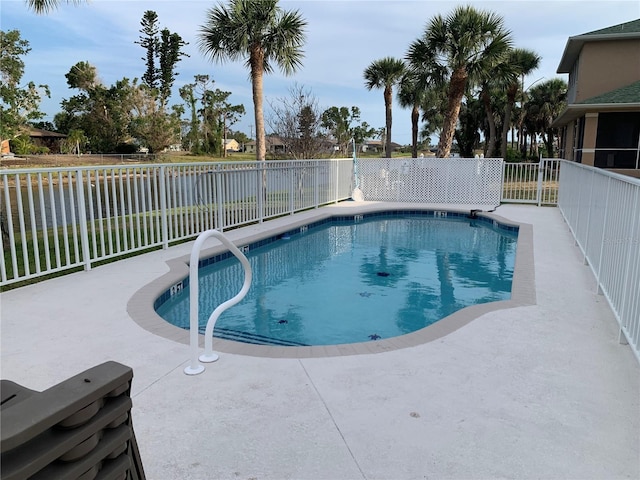 view of pool featuring a fenced in pool, a fenced backyard, and a patio