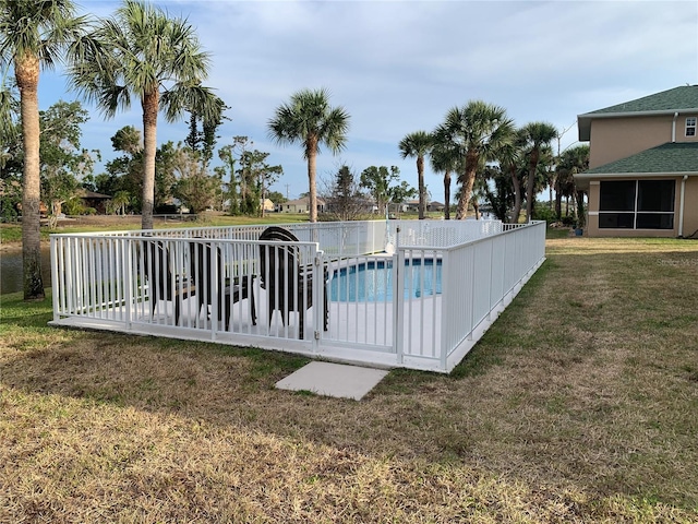 view of pool featuring fence, a fenced in pool, and a yard