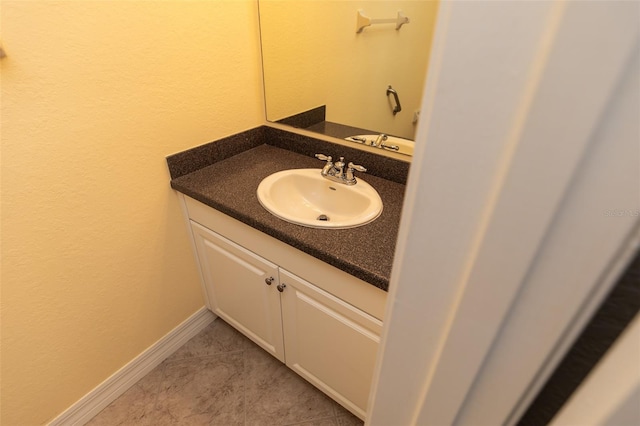 bathroom featuring tile patterned floors and vanity