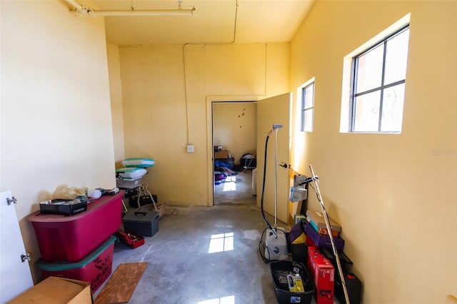 hall featuring concrete flooring