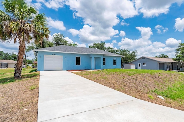 21480 Eldred Ave, Port Charlotte, FL 33952 - single story home with a garage, stucco siding, concrete driveway, and a front lawn