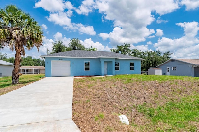 21480 Eldred Ave, Port Charlotte, FL 33952 - ranch-style home featuring an attached garage, stucco siding, driveway, and a front yard