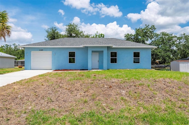21480 Eldred Ave, Port Charlotte, FL 33952 - ranch-style house with stucco siding, an attached garage, concrete driveway, and a front lawn