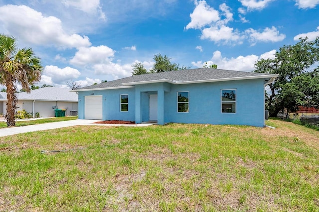 21480 Eldred Ave, Port Charlotte, FL 33952 - single story home with stucco siding, an attached garage, driveway, a front yard, and roof with shingles