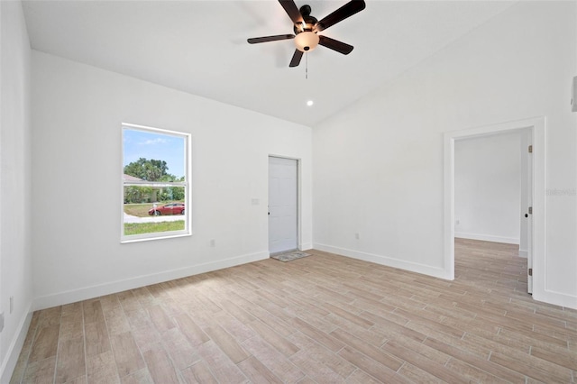 21480 Eldred Ave, Port Charlotte, FL 33952 - unfurnished room with ceiling fan, light wood-style floors, baseboards, and high vaulted ceiling