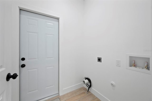 21480 Eldred Ave, Port Charlotte, FL 33952 - washroom with hookup for an electric dryer, light wood finished floors, washer hookup, and baseboards