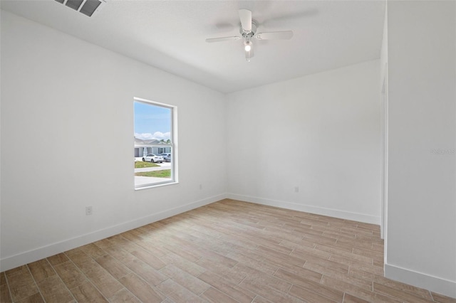 21480 Eldred Ave, Port Charlotte, FL 33952 - unfurnished room with a ceiling fan, light wood-style floors, and baseboards