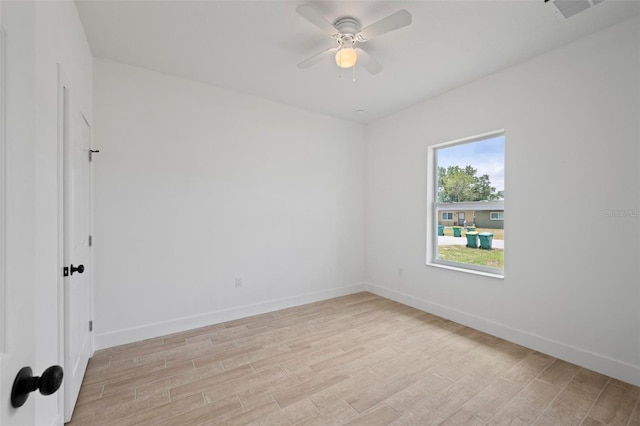 21480 Eldred Ave, Port Charlotte, FL 33952 - unfurnished room featuring light wood-style flooring, a ceiling fan, and baseboards
