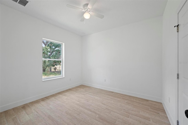 21480 Eldred Ave, Port Charlotte, FL 33952 - spare room featuring light wood-type flooring, a ceiling fan, and baseboards