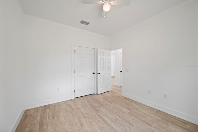 21480 Eldred Ave, Port Charlotte, FL 33952 - unfurnished room featuring light wood-style flooring, baseboards, and a ceiling fan