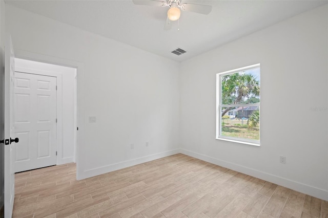 21480 Eldred Ave, Port Charlotte, FL 33952 - unfurnished room with light wood-style flooring, ceiling fan, and baseboards