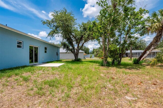 21480 Eldred Ave, Port Charlotte, FL 33952 - view of grassy yard with a patio