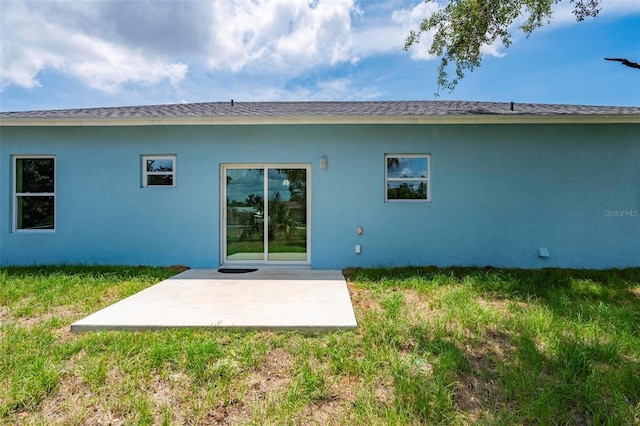 21480 Eldred Ave, Port Charlotte, FL 33952 - rear view of property featuring a patio area, stucco siding, and a yard
