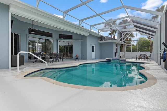 18652 Ohara Dr, Port Charlotte, FL 33948 - view of swimming pool with a patio area, a pool with connected hot tub, a ceiling fan, and outdoor dining space