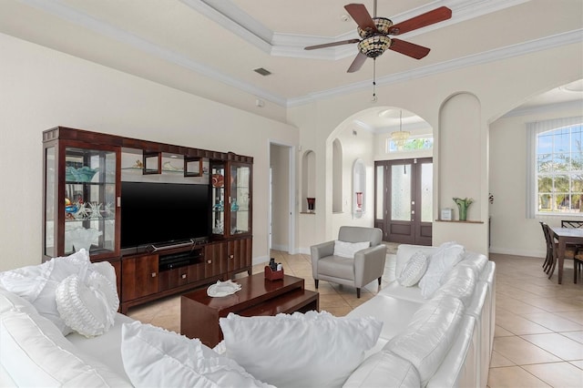 18652 Ohara Dr, Port Charlotte, FL 33948 - living area with arched walkways, crown molding, and light tile patterned floors