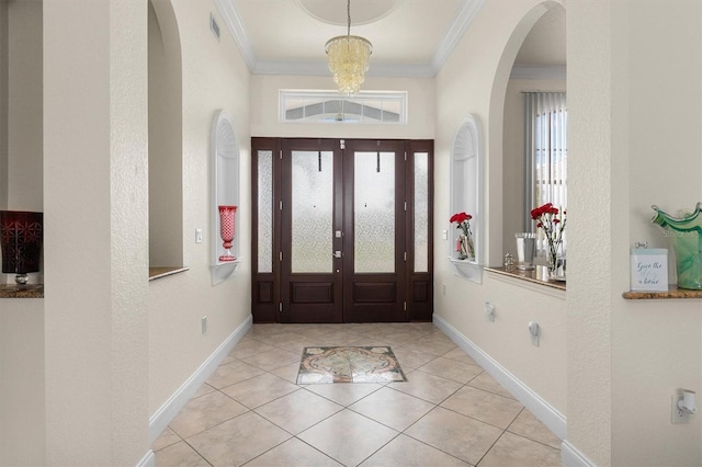 18652 Ohara Dr, Port Charlotte, FL 33948 - entryway with visible vents, ornamental molding, arched walkways, baseboards, and a chandelier