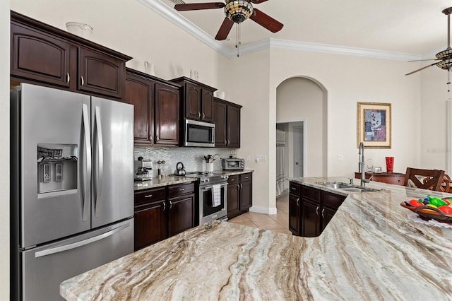 18652 Ohara Dr, Port Charlotte, FL 33948 - kitchen with a sink, light tile patterned flooring, ceiling fan, crown molding, and appliances with stainless steel finishes