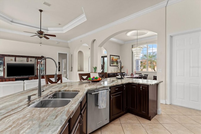 18652 Ohara Dr, Port Charlotte, FL 33948 - kitchen featuring a sink, open floor plan, light stone counters, ceiling fan, and dishwasher
