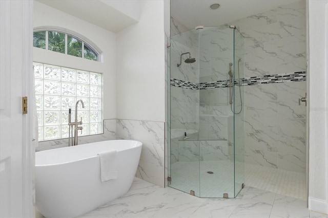 18652 Ohara Dr, Port Charlotte, FL 33948 - bathroom featuring a wealth of natural light, marble finish floor, and a marble finish shower