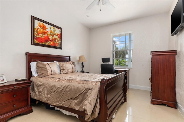 18652 Ohara Dr, Port Charlotte, FL 33948 - bedroom featuring baseboards, a ceiling fan, and light tile patterned floors