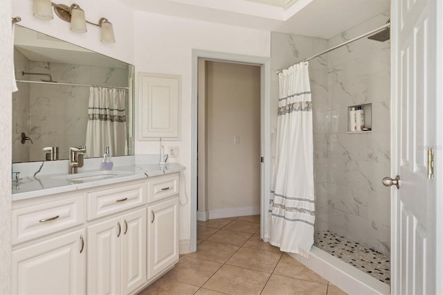 18652 Ohara Dr, Port Charlotte, FL 33948 - bathroom featuring tile patterned flooring, baseboards, vanity, and tiled shower