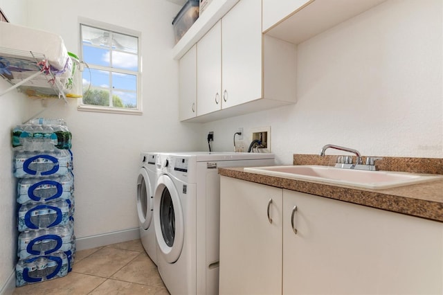 18652 Ohara Dr, Port Charlotte, FL 33948 - laundry area featuring cabinet space, separate washer and dryer, light tile patterned flooring, and a sink