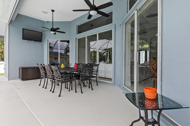 18652 Ohara Dr, Port Charlotte, FL 33948 - view of patio / terrace with outdoor dining space, visible vents, and a ceiling fan