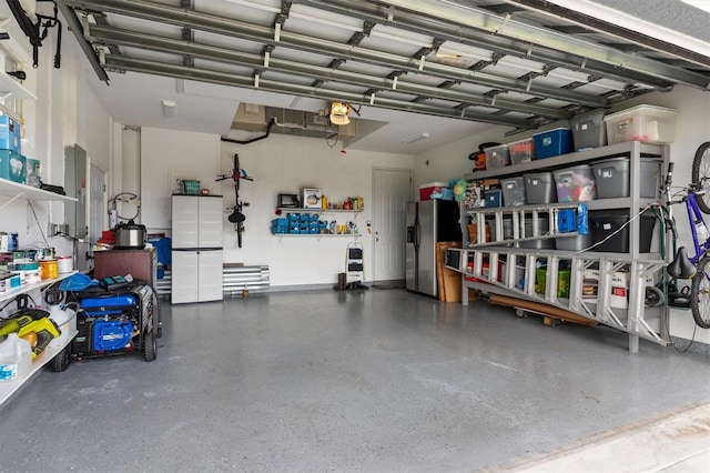 18652 Ohara Dr, Port Charlotte, FL 33948 - garage with stainless steel fridge