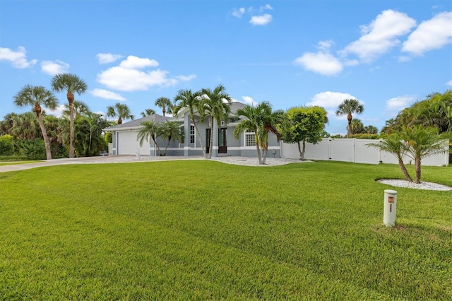 18652 Ohara Dr, Port Charlotte, FL 33948 - view of front of home with concrete driveway, an attached garage, fence, and a front yard