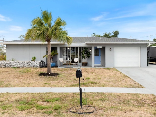 6531 Marius Rd, North Port, FL 34287 - ranch-style house with an attached garage, concrete driveway, and a front lawn