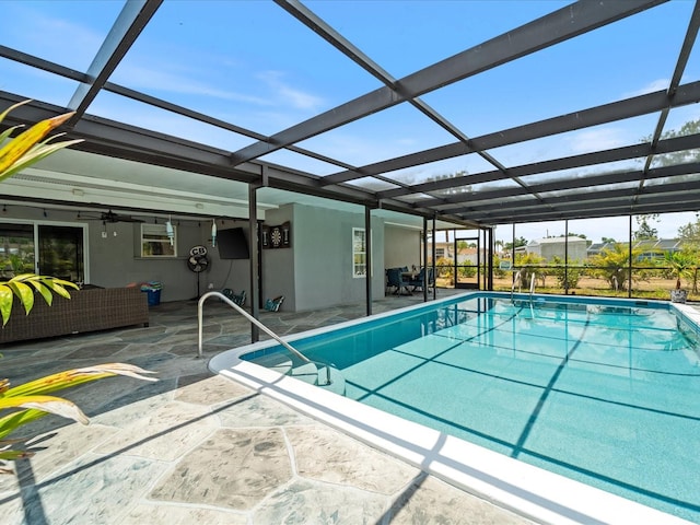 6531 Marius Rd, North Port, FL 34287 - pool with glass enclosure, an outdoor living space, a ceiling fan, and a patio area