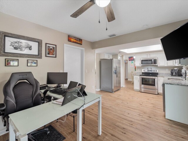 6531 Marius Rd, North Port, FL 34287 - office space with a ceiling fan, visible vents, a sink, baseboards, and light wood-style flooring