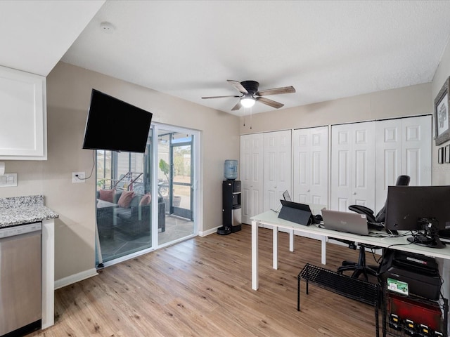 6531 Marius Rd, North Port, FL 34287 - home office featuring baseboards, light wood finished floors, and ceiling fan