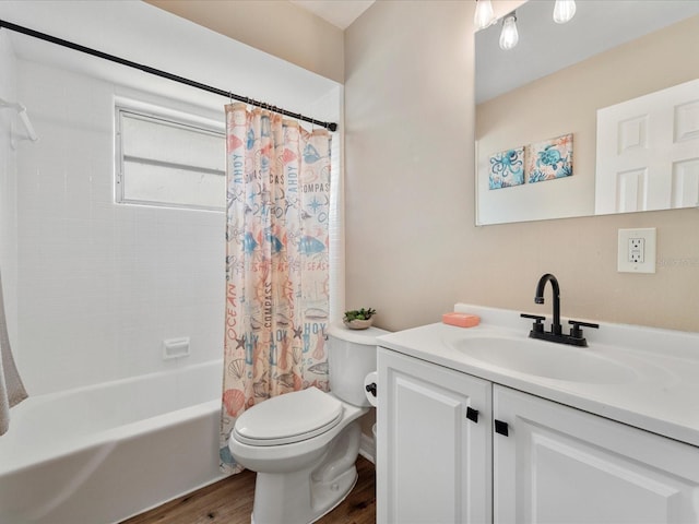 6531 Marius Rd, North Port, FL 34287 - bathroom featuring toilet, shower / bathtub combination with curtain, wood finished floors, and vanity