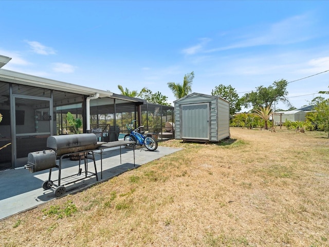 6531 Marius Rd, North Port, FL 34287 - view of yard with an outdoor structure, a sunroom, a patio area, and a shed