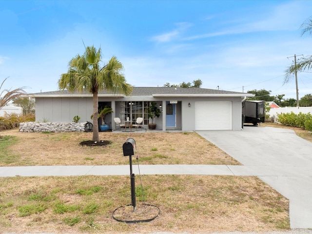 6531 Marius Rd, North Port, FL 34287 - ranch-style house featuring an attached garage, driveway, and a front yard