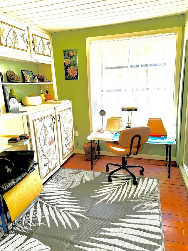 sitting room with wood-type flooring and baseboards