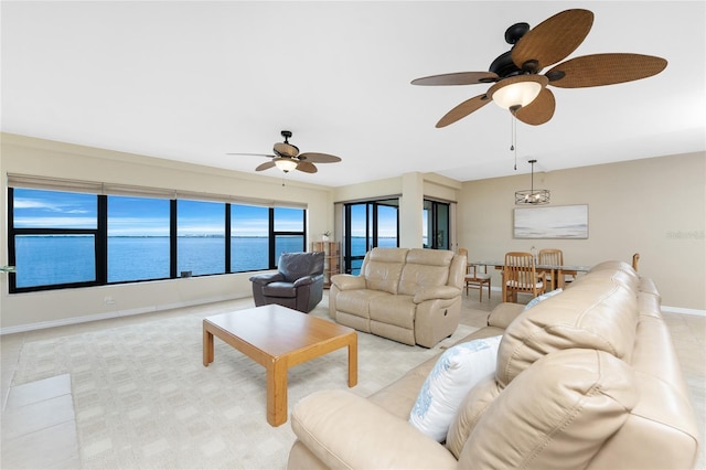1750 Jamaica Way Unit 312, Punta Gorda, FL 33950 - living room with baseboards, a ceiling fan, and a water view
