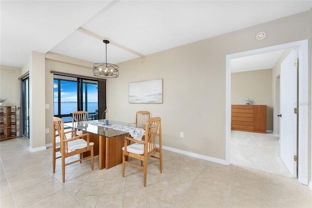 1750 Jamaica Way Unit 312, Punta Gorda, FL 33950 - dining room with baseboards, a notable chandelier, and light tile patterned floors