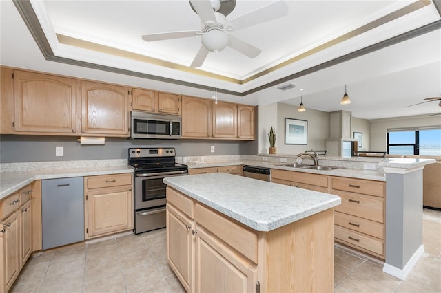 1750 Jamaica Way Unit 312, Punta Gorda, FL 33950 - kitchen featuring stainless steel appliances, light brown cabinetry, a sink, a tray ceiling, and ceiling fan